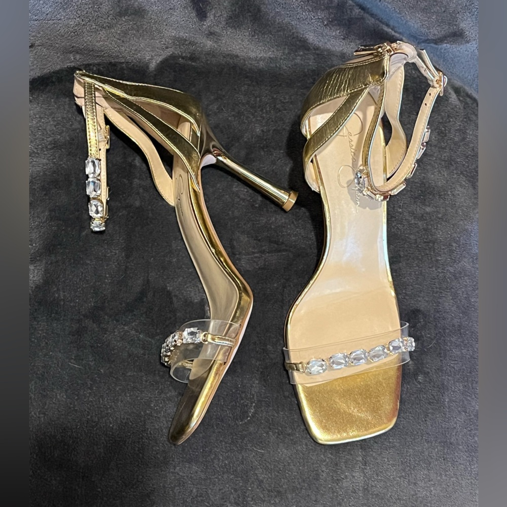 Jessica Simpson Gold Metallic Heel Sandals. Clear strap, rhinestone details. 10